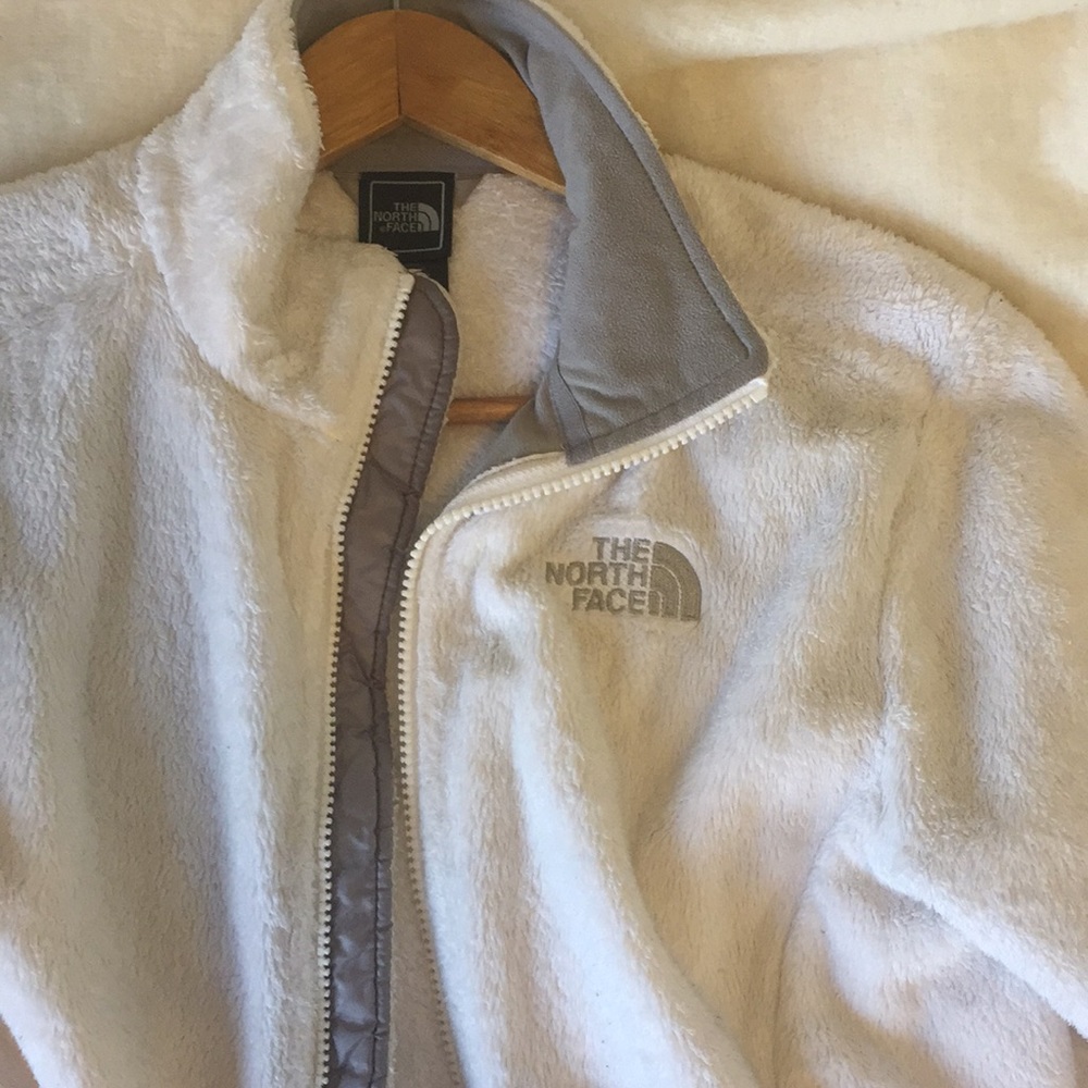 white furry north face zip up small